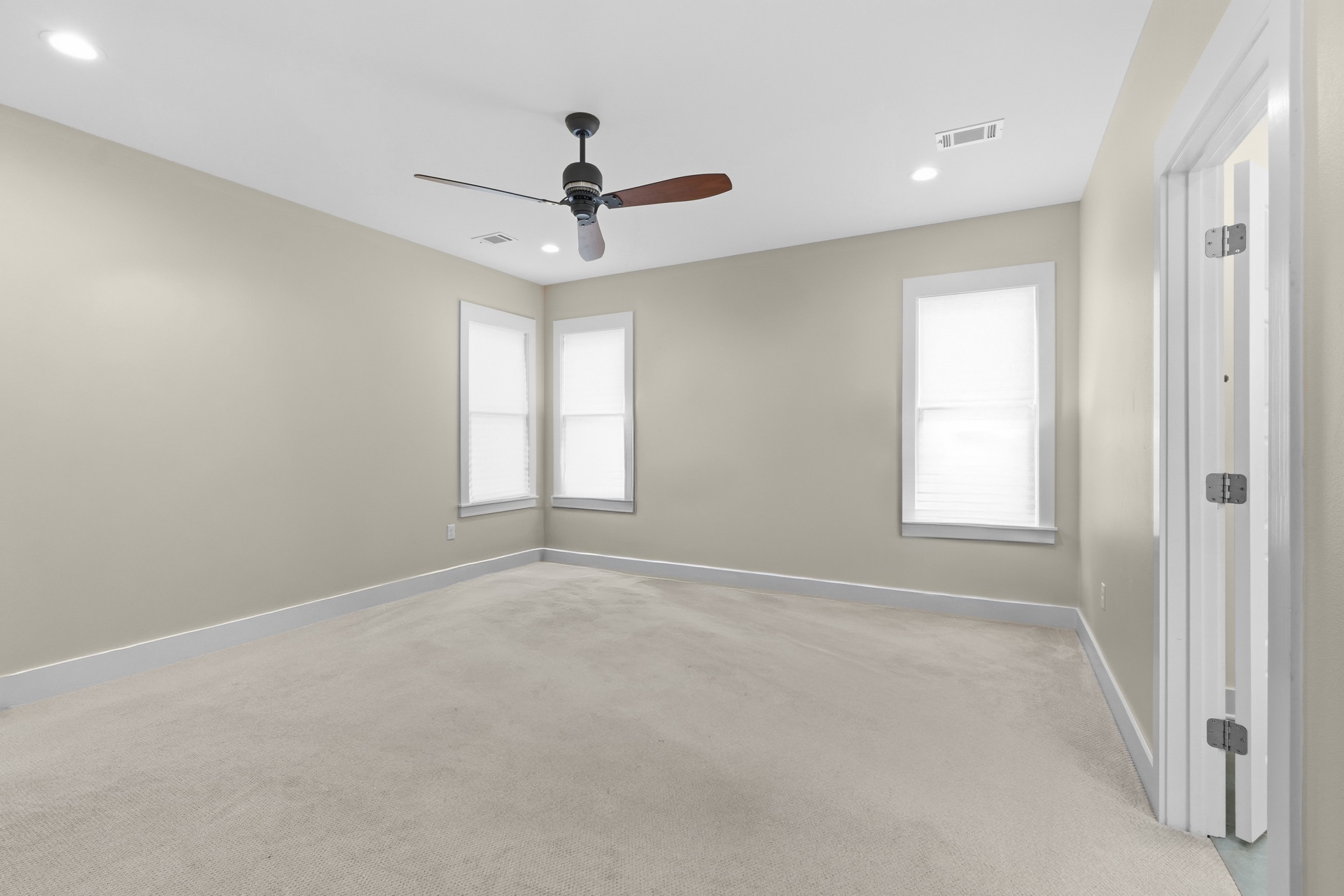 The same bedroom cleared of furniture and belongings