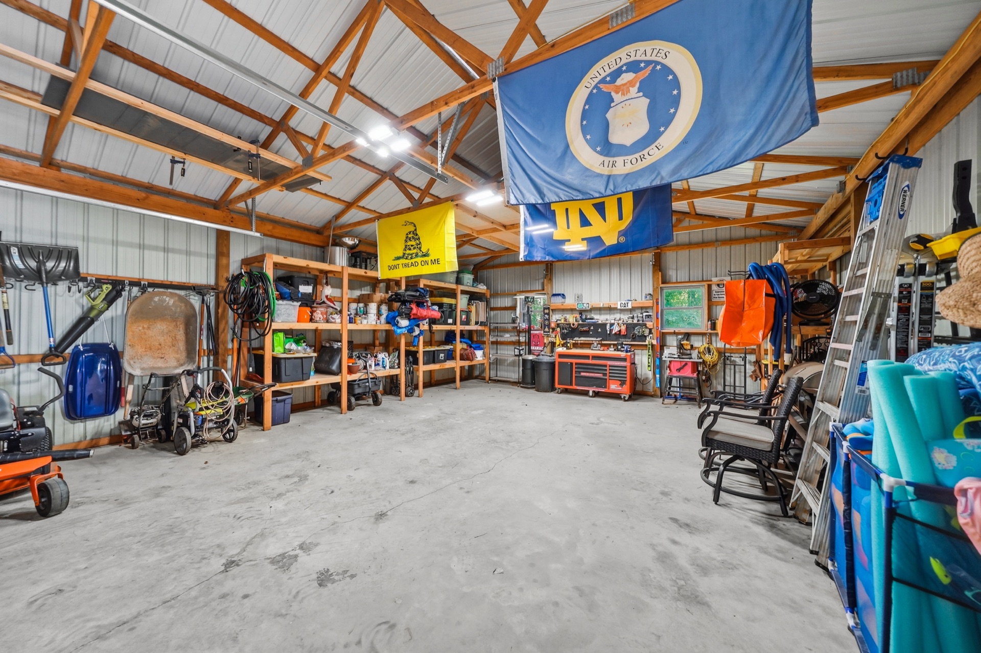 Workshop packed with tools, flags, and stored gear
