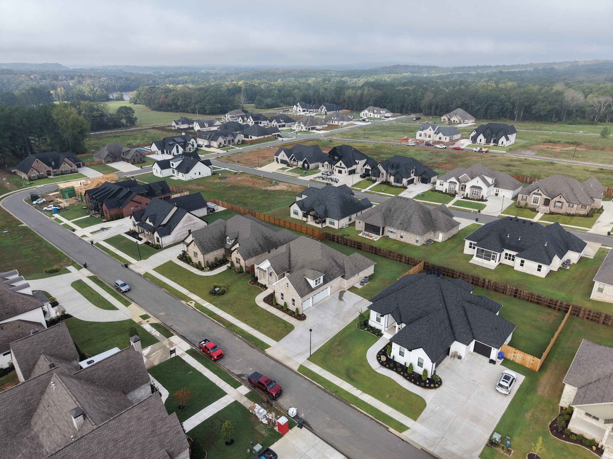 Neighborhood aerial with cars on the street